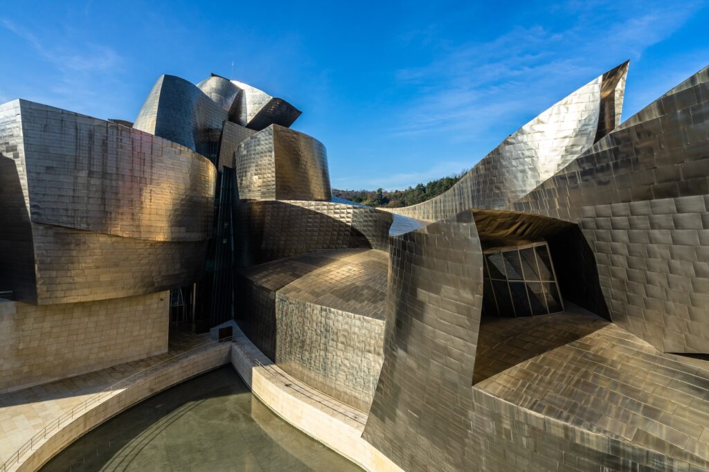 A closeup view of Guggenheim Museum's modern facade in Bilbao Spain
